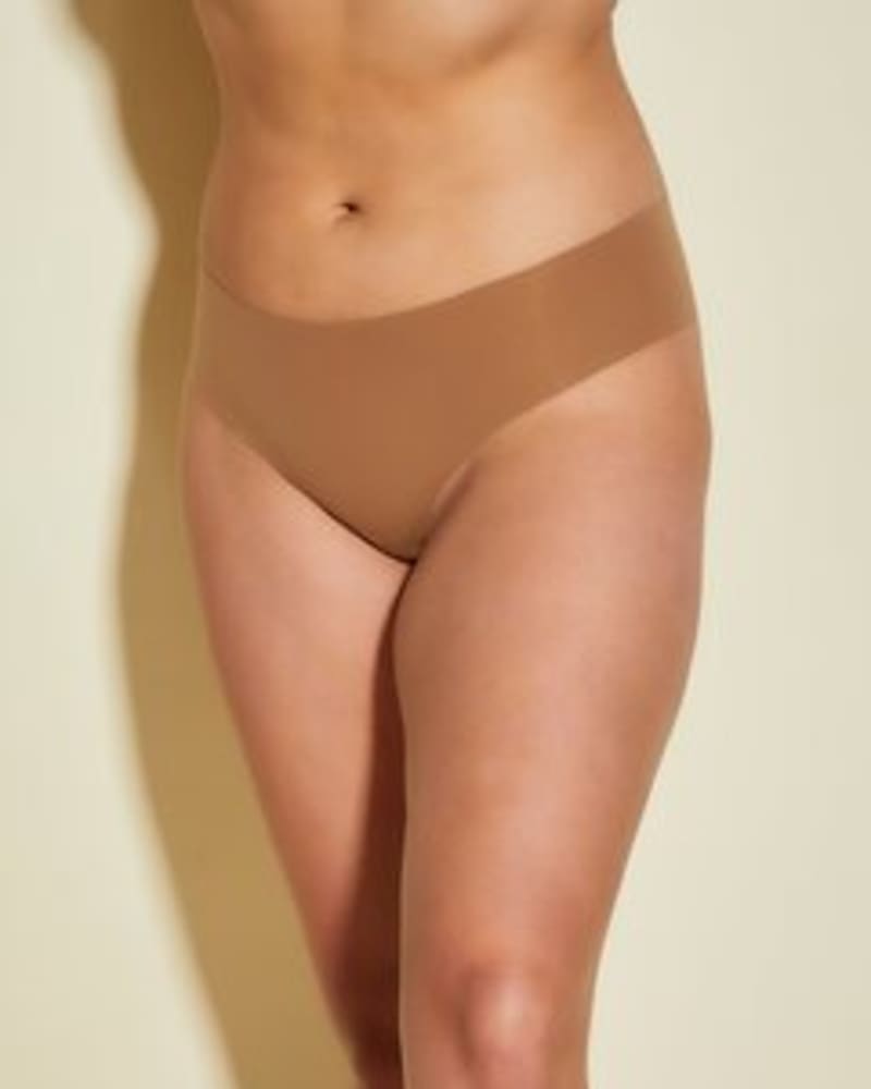 Front of a model wearing a size 1X Free Cut Low Rise Thong in Quattro by Cosabella. | dia_product_style_image_id:253586